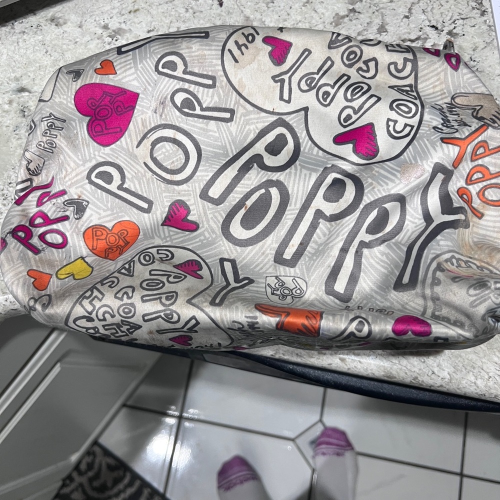 Coach Pink-Lined Cosmetic Pouch with Logo Exterior